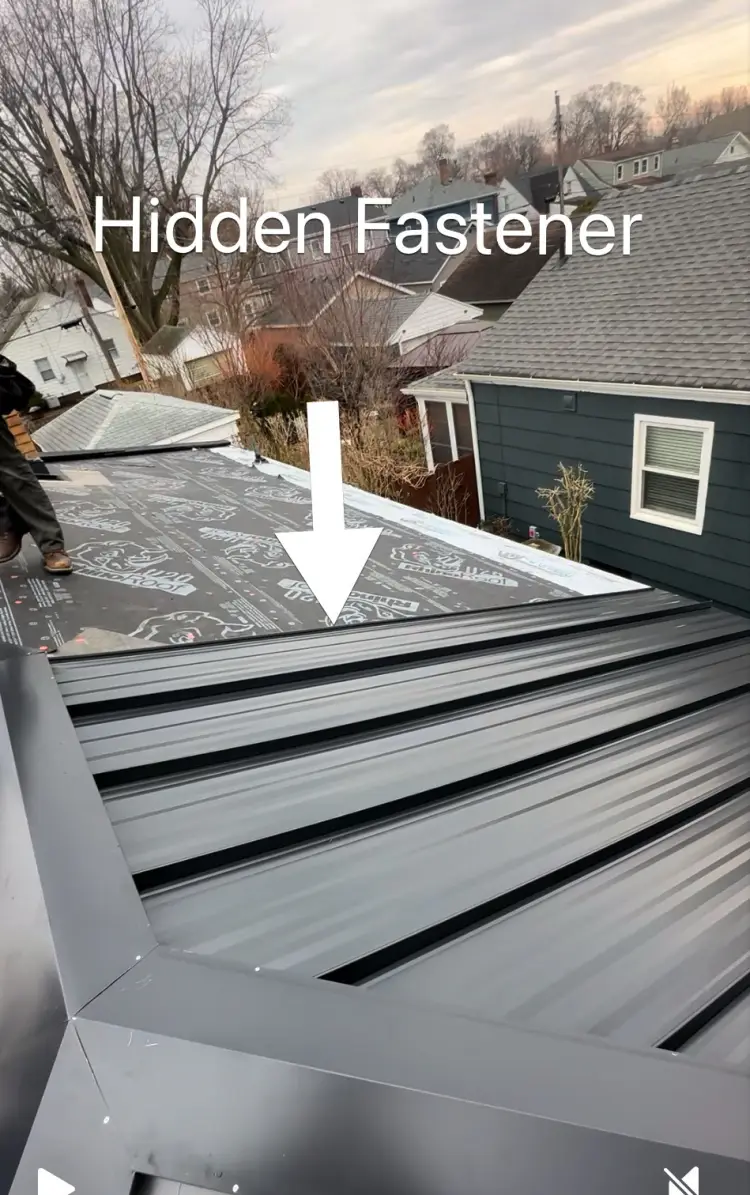 Exposed fastener metal roof panel showing screw pattern