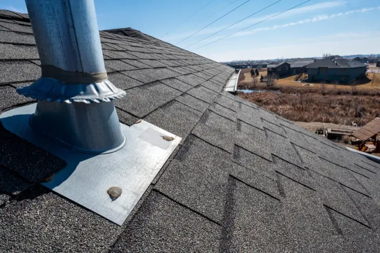 Pipe flashing on shingle roof